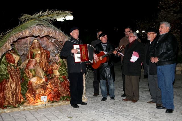 December 24 - Christmas Eve - 'Kantadoroi' carols next to the nativity